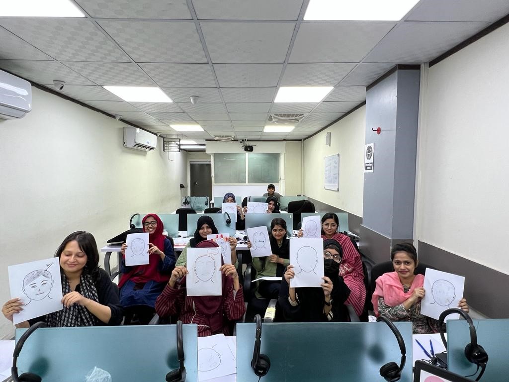 womens are showing a drawing 